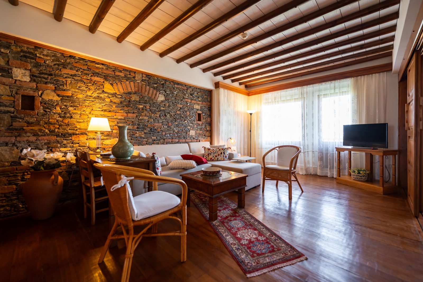 Deluxe suite salon with stone wall