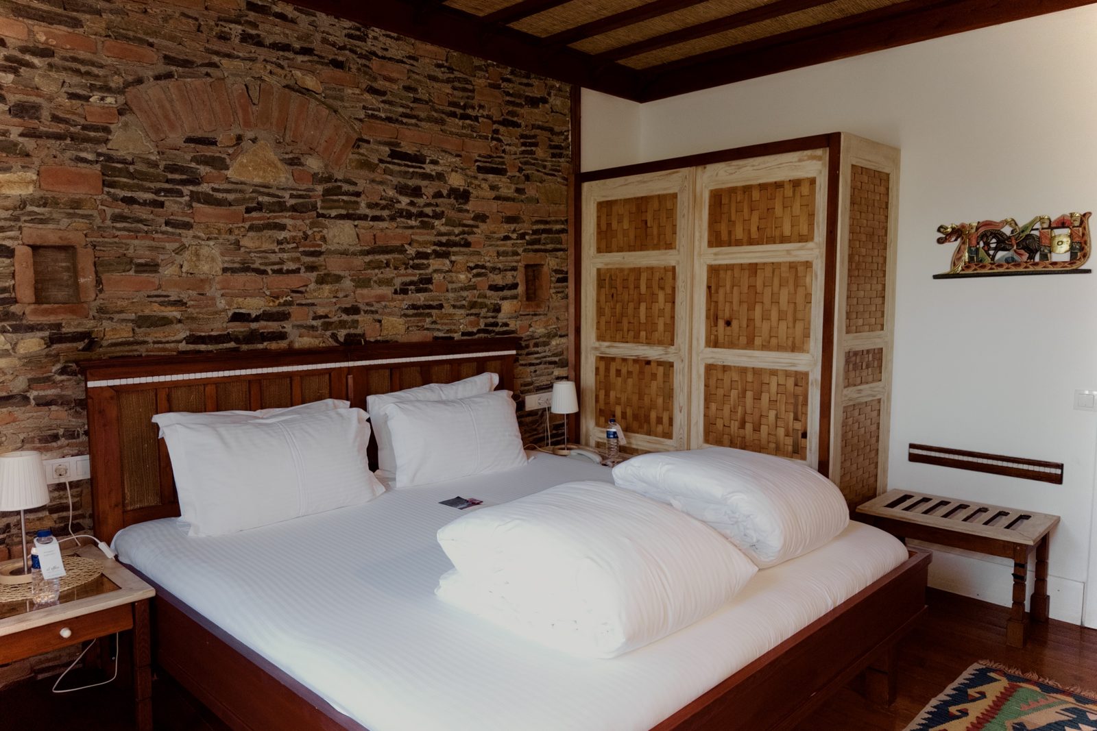 Comfort room with stone wall