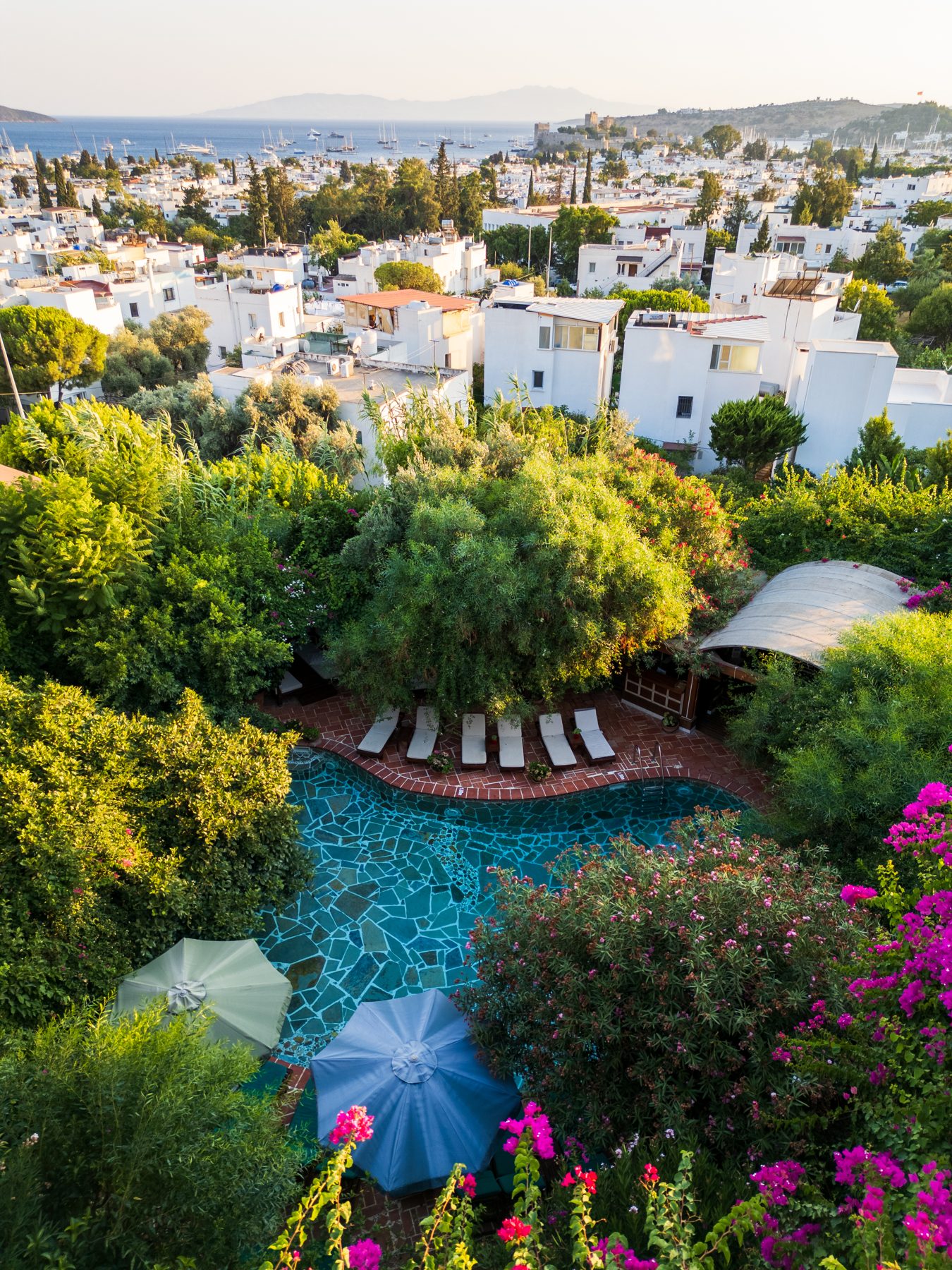 Garden pool above the white town and bay